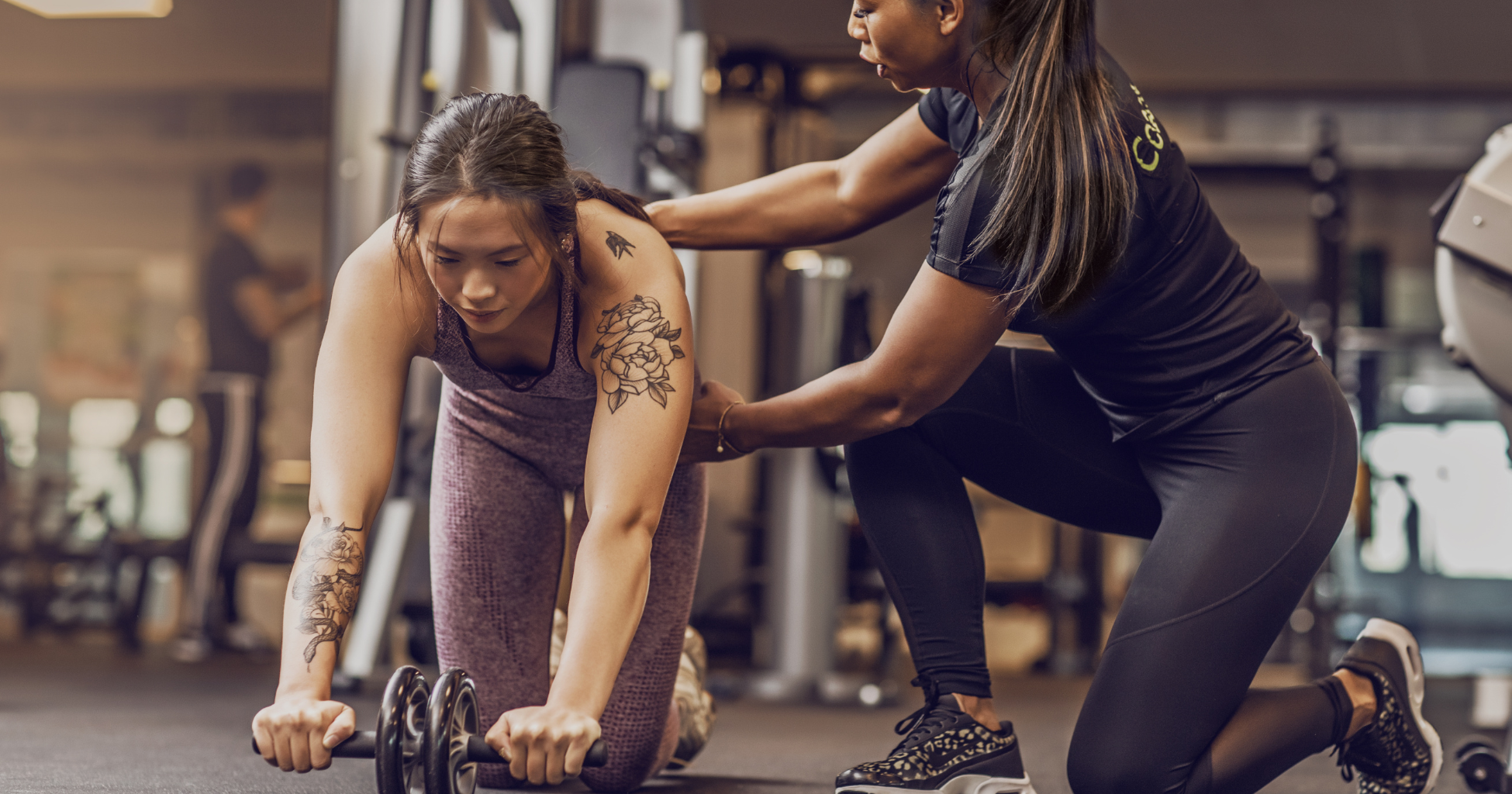 Personal trainer coaching a client in a Sydney gym